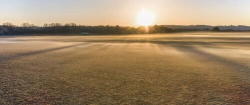 Beautiful foggy sunrise landscape in West Newton, Minnesota, USA, capturing autumn fields.